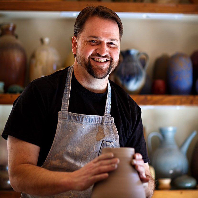 Ben Owen making pottery in a work shop